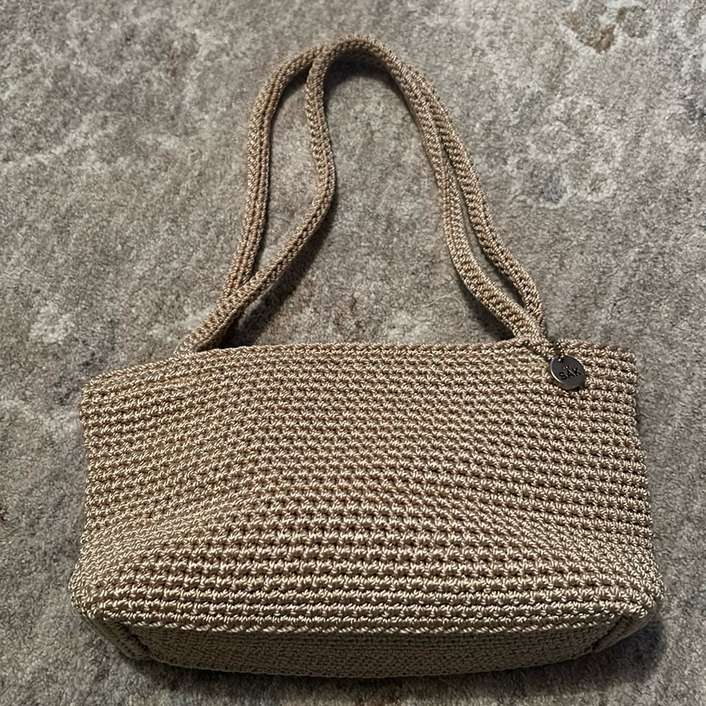 The Sak natural color small crocheted purse with silver tone hardware